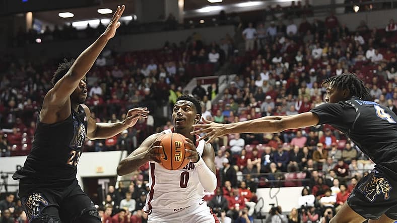 Dec 13, 2022; Tuscaloosa, Alabama, USA; Alabama guard Jaden Bradley (0) drives between Memphis forward Malcolm Dandridge (23) and Memphis forward Chandler Lawson (4) at Coleman Coliseum. Mandatory Credit: Gary Cosby Jr.-USA TODAY Sports