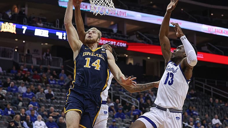 Dec 14, 2022; Newark, New Jersey, USA; Drexel Dragons guard Luke House (14) drives to the basket against Seton Hall Pirates forward KC Ndefo (13) during the first half at Prudential Center. Mandatory Credit: Vincent Carchietta-USA TODAY Sports