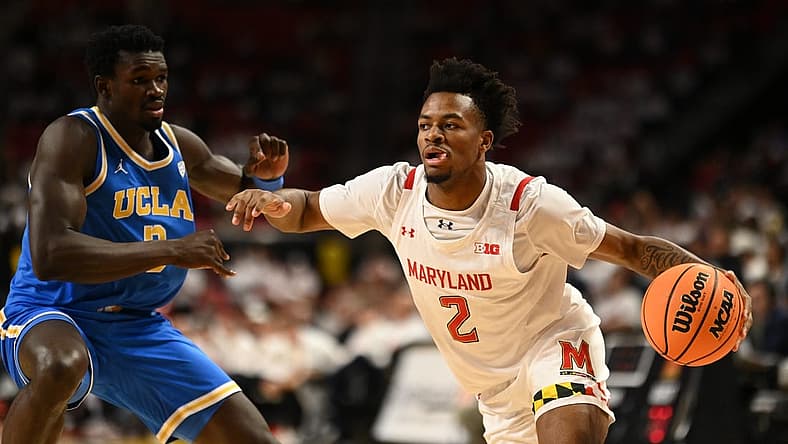 Dec 14, 2022; College Park, Maryland, USA; Maryland Terrapins guard Jahari Long (2) dribble by UCLA Bruins forward Adem Bona (3) during the second half at Xfinity Center. Mandatory Credit: Tommy Gilligan-USA TODAY Sports