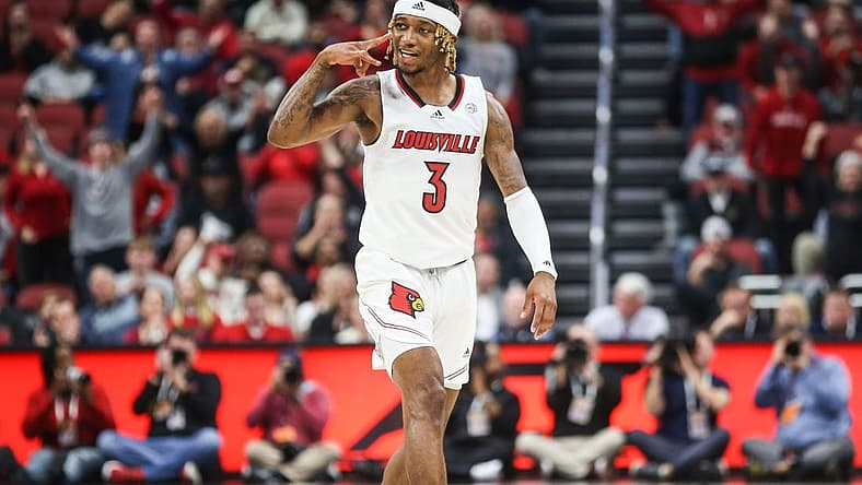 Louisville's El Ellis signals a three while he celebrates after hitting a three-point shot early in first half as the Cards beat WKU 94-83 at the Yum! Center in downtown Louisville Wednesday night. Dec. 14, 2022
Louisville Men Vs Western Kentucky Basketball 2022