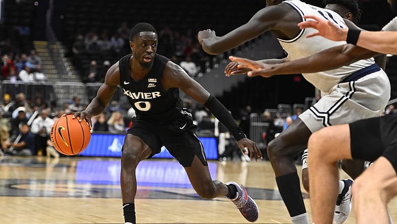 Dec 16, 2022; Washington, District of Columbia, USA; Xavier Musketeers guard Souley Boum (0) dribbles against the Georgetown Hoyas during the second half at Capital One Arena. Mandatory Credit: Brad Mills-USA TODAY Sports