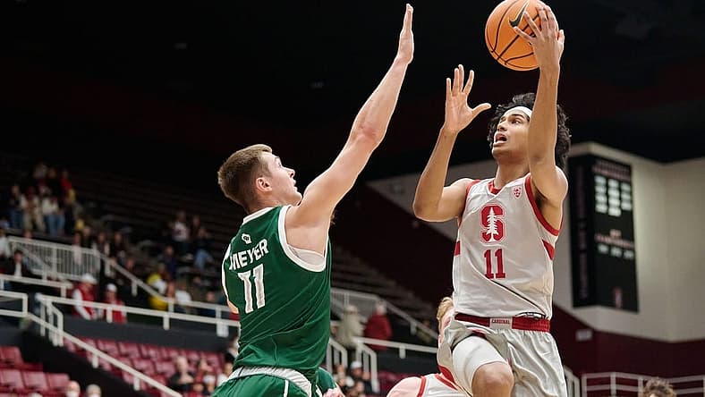 Dec 16, 2022; Stanford, California, USA; Stanford Cardinal guard Ryan Agarwal (11) shoots the basketball against Green Bay Phoenix forward Cade Meyer (11) during the first half at Maples Pavilion. Mandatory Credit: Robert Edwards-USA TODAY Sports