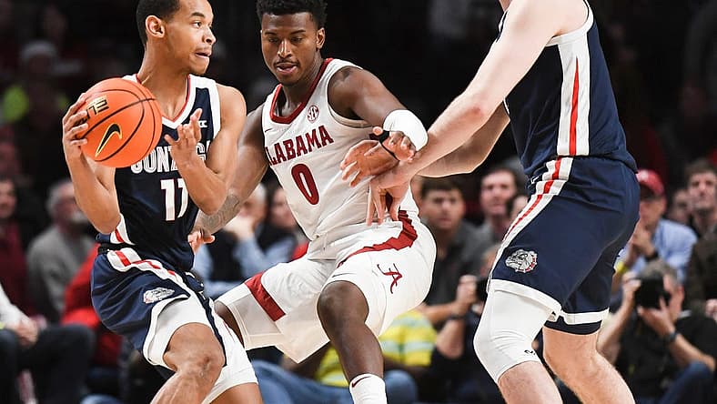 Dec 17, 2022; Birmingham, AL, USA; Alabama guard Jaden Bradley (0) tries to work through a screen by Gonzaga forward Drew Timme (2) as he guard Gonzaga guard Nolan Hickman (11) at Legacy Arena.

Ncaa Basketball Alabama Vs Gonzaga Cm Newton Classic