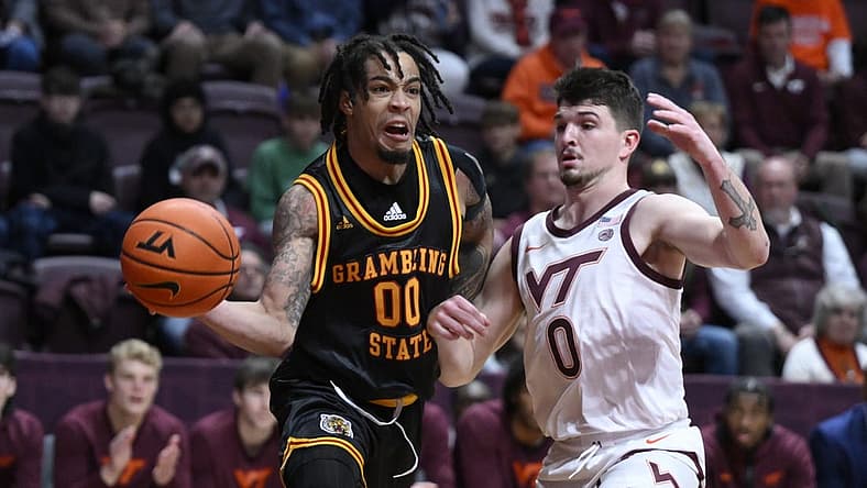 Dec 17, 2022; Blacksburg, Virginia, USA; Grambling Tigers Virshon Cotton (00) drives around Virginia Tech Hokies guard Hunter Cattoor (0) in the first halfat Cassell Coliseum. Mandatory Credit: Lee Luther Jr.-USA TODAY Sports