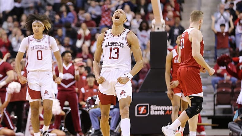 Dec 17, 2022; North Little Rock, Arkansas, USA; Arkansas Razorbacks guard Jordan Walsh (13) celebrates after scoring in the first half against the Bradley Braves at Simmons Bank Arena. Mandatory Credit: Nelson Chenault-USA TODAY Sports