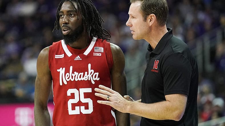 Dec 17, 2022; Kansas City, Missouri, USA; Nebraska Cornhuskers head coach Fred Hoiberg talks with guard Emmanuel Bandoumel (25) against the Kansas State Wildcats during the first half at T-Mobile Center. Mandatory Credit: Denny Medley-USA TODAY Sports