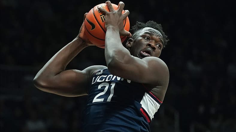 Dec 17, 2022; Indianapolis, Indiana, USA; Connecticut Huskies forward Adama Sanogo (21) rebounds the ball against the Butler Bulldogs during the first half at Hinkle Fieldhouse. Mandatory Credit: Robert Goddin-USA TODAY Sports