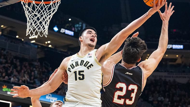Dec 17, 2022; Indianapolis, Indiana, USA; Purdue Boilermakers center Zach Edey (15) rebounds the ball against Davidson Wildcats guard Connor Kochera (23) in the second half at Gainbridge Fieldhouse. Mandatory Credit: Trevor Ruszkowski-USA TODAY Sports