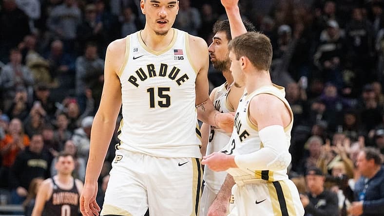 Dec 17, 2022; Indianapolis, Indiana, USA; Purdue Boilermakers guard Braden Smith (3) celebrates with center Zach Edey (15) after defeating the Davidson Wildcats at Gainbridge Fieldhouse. Mandatory Credit: Trevor Ruszkowski-USA TODAY Sports