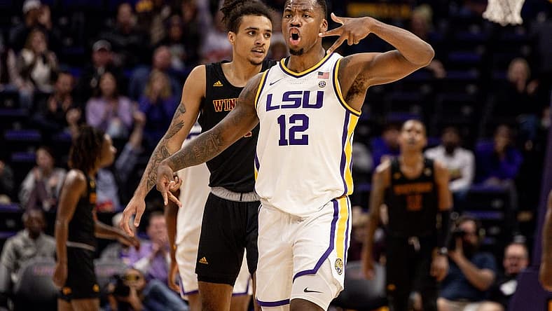 Dec 17, 2022; Baton Rouge, Louisiana, USA; LSU Tigers forward KJ Williams (12) reacts to making a three point basket in the final minute of the game against the Winthrop Eagles during the second half at Pete Maravich Assembly Center. Mandatory Credit: Stephen Lew-USA TODAY Sports