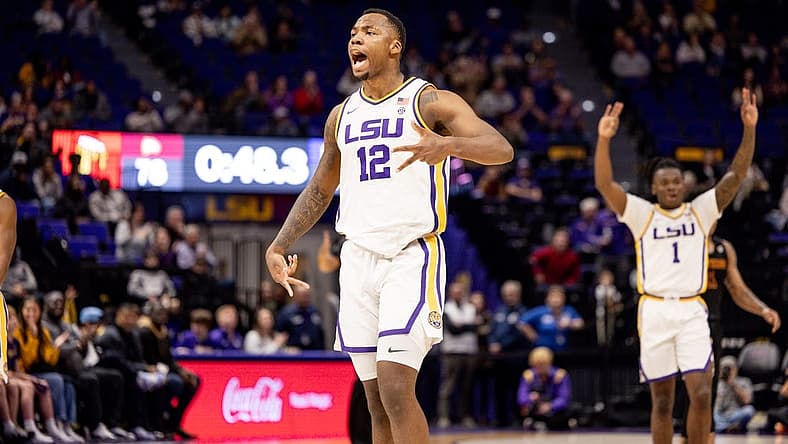 Dec 17, 2022; Baton Rouge, Louisiana, USA;  LSU Tigers forward KJ Williams (12) reacts to making a three point basket in the final minute of the game against the Winthrop Eagles during the second half at Pete Maravich Assembly Center. Mandatory Credit: Stephen Lew-USA TODAY Sports