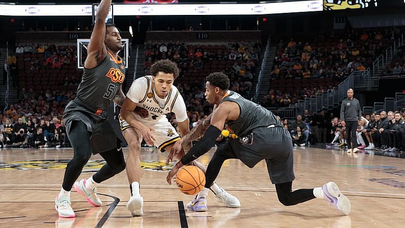 Dec 17, 2022; Wichita, Kansas, USA; Wichita State Shockers guard Craig Porter Jr. (3) goes after a loose ball during the first half against the Oklahoma State Cowboys at INTRUST Bank Arena. Mandatory Credit: William Purnell-USA TODAY Sports