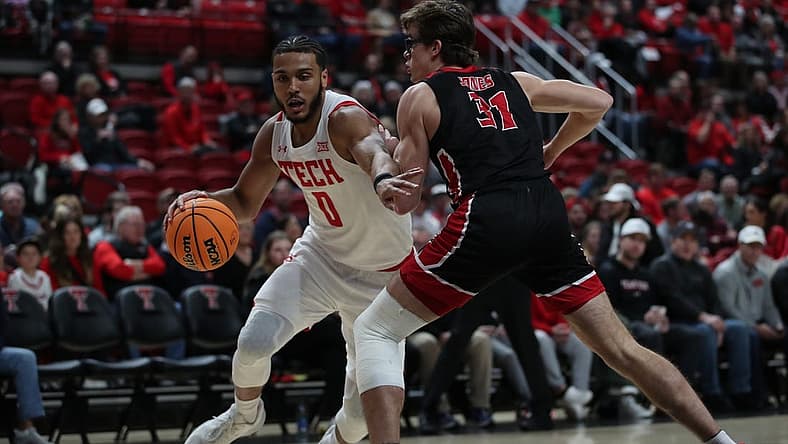 Dec 13, 2022; Lubbock, Texas, USA; Texas Tech Red Raiders forward Kevin Obanor (0) dribbles the ball against Eastern Washington Eagles forward Casey Jones (31) in the first half at United Supermarkets Arena. Mandatory Credit: Michael C. Johnson-USA TODAY Sports