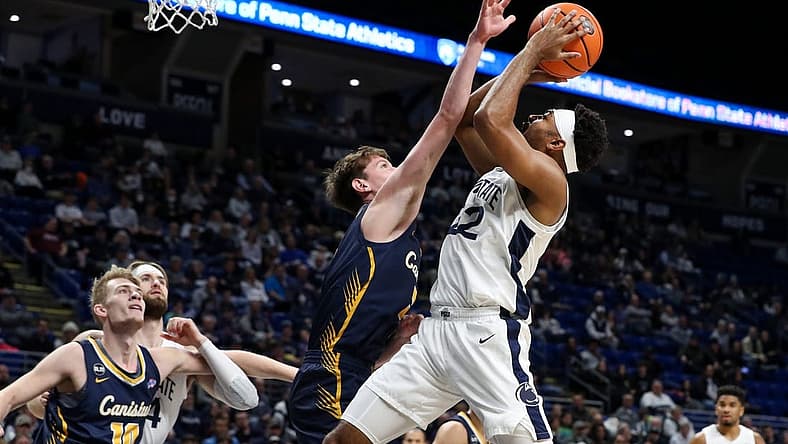 Dec 18, 2022; University Park, Pennsylvania, USA; Penn State Nittany Lions guard Jalen Pickett (22) drives the ball to the basket as Canisius Golden Griffins guard Siem Uijtendaal (5) defends during the first half at Bryce Jordan Center. Mandatory Credit: Matthew OHaren-USA TODAY Sports