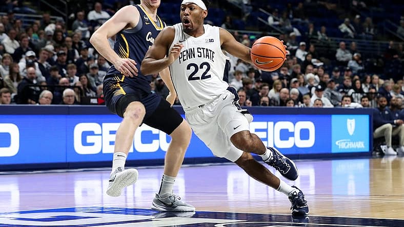Dec 18, 2022; University Park, Pennsylvania, USA; Penn State Nittany Lions guard Jalen Pickett (22) dribbles the ball around Canisius Golden Griffins forward Jacco Fritz (10) during the first half at Bryce Jordan Center. Penn State defeated Canisius 97-67. Mandatory Credit: Matthew OHaren-USA TODAY Sports