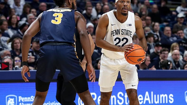 Dec 18, 2022; University Park, Pennsylvania, USA; Penn State Nittany Lions guard Jalen Pickett (22) holds the ball as Canisius Golden Griffins guard Jordan Henderson (3) defends during the first half at Bryce Jordan Center. Penn State defeated Canisius 97-67. Mandatory Credit: Matthew OHaren-USA TODAY Sports