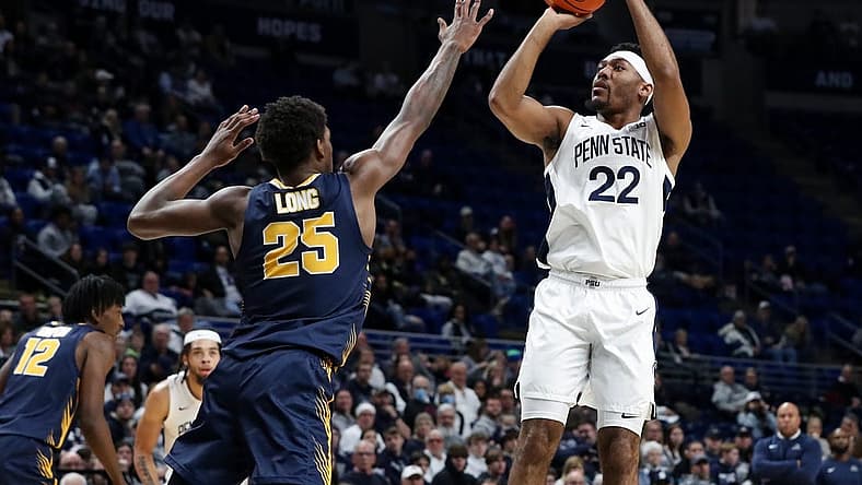 Dec 18, 2022; University Park, Pennsylvania, USA; Penn State Nittany Lions guard Jalen Pickett (22) shoots the ball as Canisius Golden Griffins guard Xzavier Long (25) defends during the first half at Bryce Jordan Center. Penn State defeated Canisius 97-67. Mandatory Credit: Matthew OHaren-USA TODAY Sports