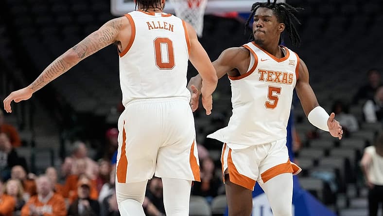 Dec 18, 2022; Dallas, Texas, USA; Texas Longhorns forward Timmy Allen (0) and Texas Longhorns guard Marcus Carr (5) celebrates after a made basket against the Stanford Cardinal during the second half at American Airlines Center. Mandatory Credit: Chris Jones-USA TODAY Sports