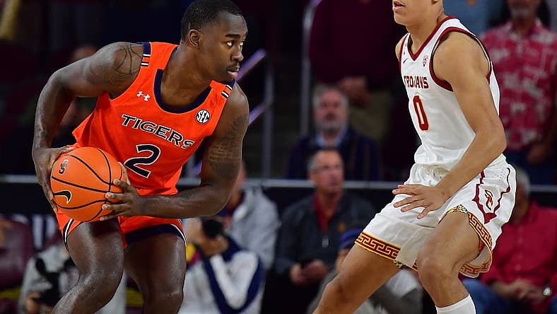 Dec 18, 2022; Los Angeles, California, USA; Auburn Tigers forward Jaylin Williams (2) controls the ball against Southern California Trojans forward Kobe Johnson (0) during the first half at Galen Center. Mandatory Credit: Gary A. Vasquez-USA TODAY Sports