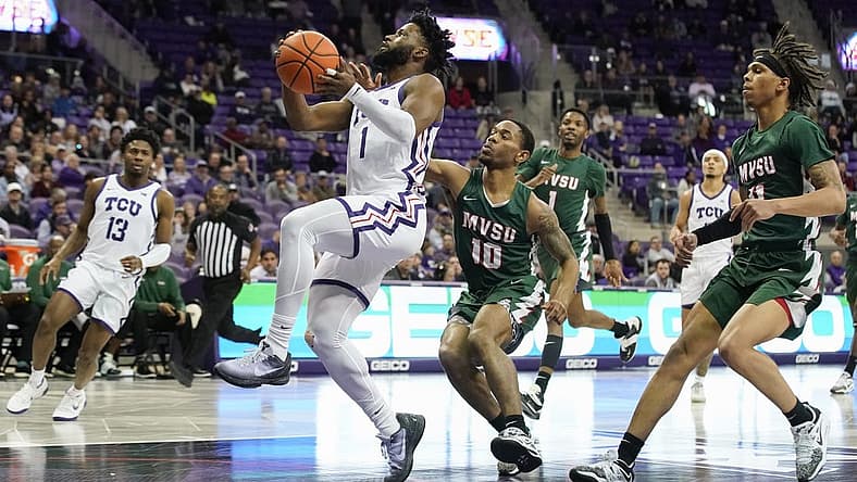 Dec 18, 2022; Fort Worth, Texas, USA; TCU Horned Frogs guard Mike Miles Jr. (1) drives to the basket, past Mississippi Valley State Delta Devils guard Danny Washington (10) during the first half at Ed and Rae Schollmaier Arena. Mandatory Credit: Raymond Carlin III-USA TODAY Sports