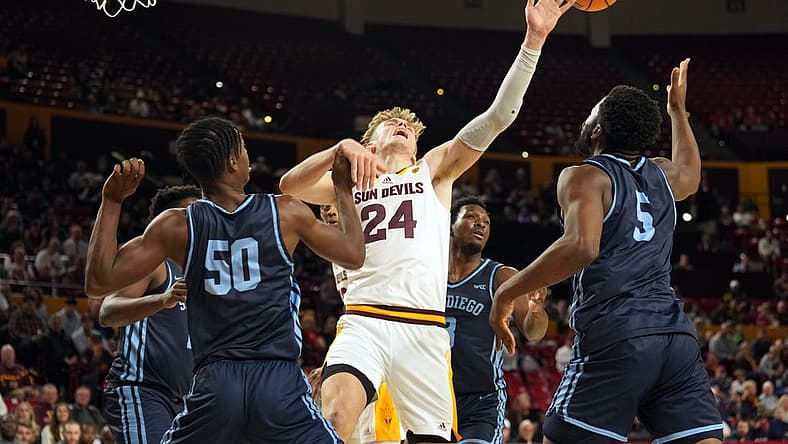 Dec 18, 2022; Tempe, Arizona, USA; Arizona State Sun Devils forward Duke Brennan (24) attempts to grab a rebound against San Diego Toreros during the first half at Desert Financial Arena. Mandatory Credit: Joe Camporeale-USA TODAY Sports