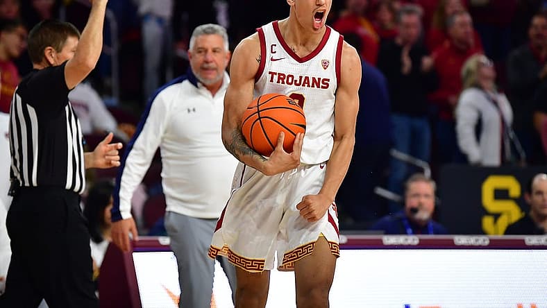 Dec 18, 2022; Los Angeles, California, USA; Southern California Trojans forward Kobe Johnson (0) reacts after drawing the foul against the Auburn Tigers during the second half at Galen Center. Mandatory Credit: Gary A. Vasquez-USA TODAY Sports