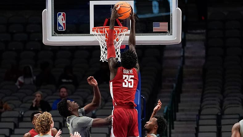 Dec 18, 2022; Dallas, Texas, USA; Washington State Cougars forward Mouhamed Gueye (35) dunks the bal over Baylor Bears forward Josh Ojianwuna (15) during the second half at American Airlines Center. Mandatory Credit: Chris Jones-USA TODAY Sports