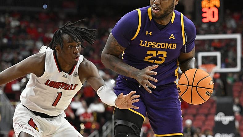 Dec 20, 2022; Louisville, Kentucky, USA; Louisville Cardinals guard Mike James (1) pressures the dribble of Lipscomb Bisons center Ahsan Asadullah (23) during the first half at KFC Yum! Center. Mandatory Credit: Jamie Rhodes-USA TODAY Sports