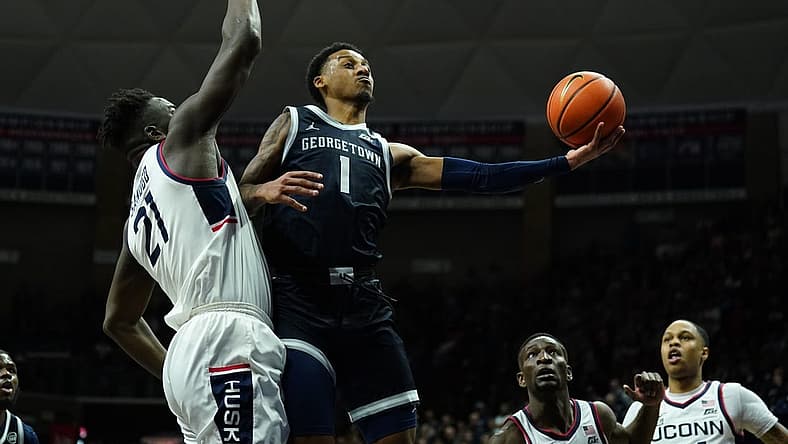 Dec 20, 2022; Storrs, Connecticut, USA; Georgetown Hoyas guard Primo Spears (1) shoots against UConn Huskies forward Adama Sanogo (21) in the second half at Harry A. Gampel Pavilion. Mandatory Credit: David Butler II-USA TODAY Sports