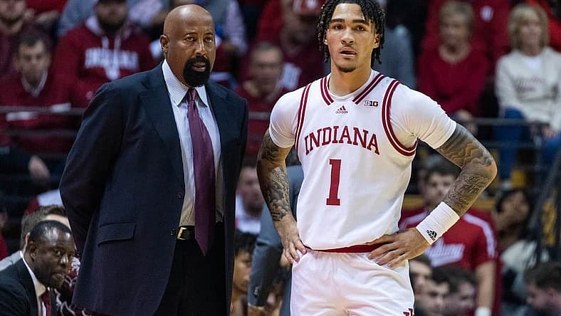 Dec 20, 2022; Bloomington, Indiana, USA; Indiana Hoosiers head coach Mike Woodson and guard Jalen Hood-Schifino (1)  in the first half against the Elon Phoenix at Simon Skjodt Assembly Hall. Mandatory Credit: Trevor Ruszkowski-USA TODAY Sports