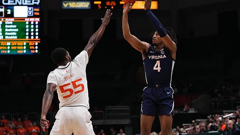 Dec 20, 2022; Coral Gables, Florida, USA; Virginia Cavaliers guard Armaan Franklin (4) shoots over Miami Hurricanes guard Wooga Poplar (55) during the first half at Watsco Center. Mandatory Credit: Jasen Vinlove-USA TODAY Sports
