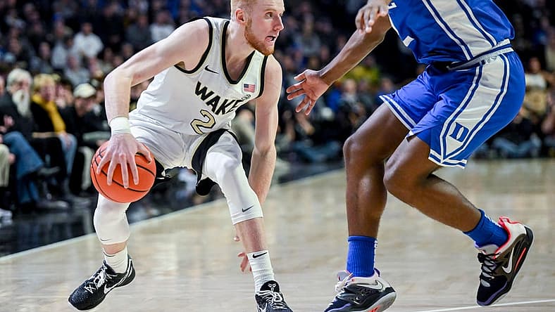 Dec 20, 2022; Winston-Salem, North Carolina, USA; Wake Forest Demon Deacons guard Cameron Hildreth (2) drives around Duke Blue Devils guard Jaylen Blakes (2) during the second half at Lawrence Joel Veterans Memorial Coliseum. Mandatory Credit: William Howard-USA TODAY Sports