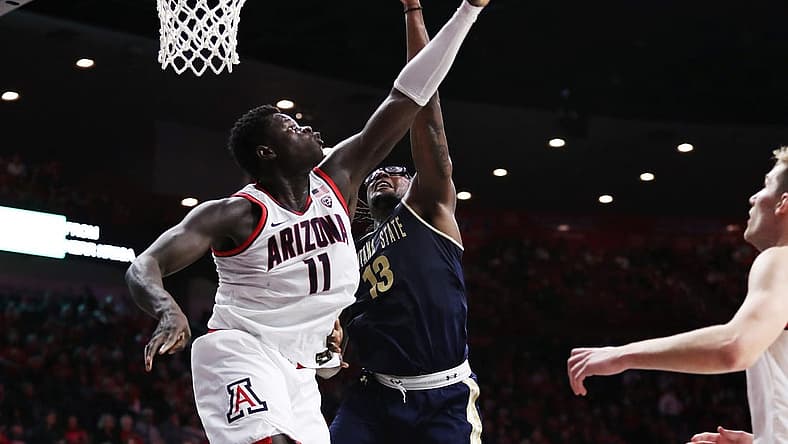 Dec 20, 2022; Tucson, Arizona, USA; Arizona Wildcats Center Oumar Ballo (11) blocks a shot from Montana State Bobcats Forward Jubrile Belo (13) in the first half at McKale Center. Mandatory Credit: Zachary BonDurant-USA TODAY Sports