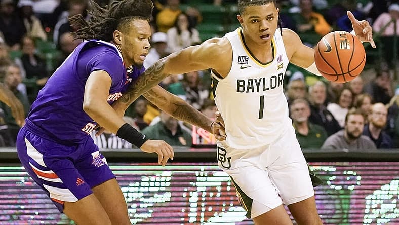 Dec 20, 2022; Waco, Texas, USA; Baylor Bears guard Keyonte George (1) works around Northwestern State Demons guard Greedy Williams (10) during the second half at Ferrell Center. Mandatory Credit: Raymond Carlin III-USA TODAY Sports