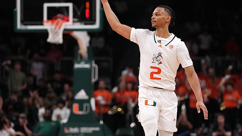 Dec 20, 2022; Coral Gables, Florida, USA; Miami Hurricanes guard Isaiah Wong (2) celebrates after making a three point basket against the Virginia Cavaliers during the second half at Watsco Center. Mandatory Credit: Jasen Vinlove-USA TODAY Sports