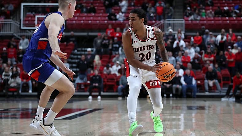 Dec 21, 2022; Lubbock, Texas, USA; Texas Tech Red Raiders guard Jaylon Tyson (20) works the ball against Houston Christian Huskies guard Maks Klanjscek (13) in the first half at United Supermarkets Arena. Mandatory Credit: Michael C. Johnson-USA TODAY Sports