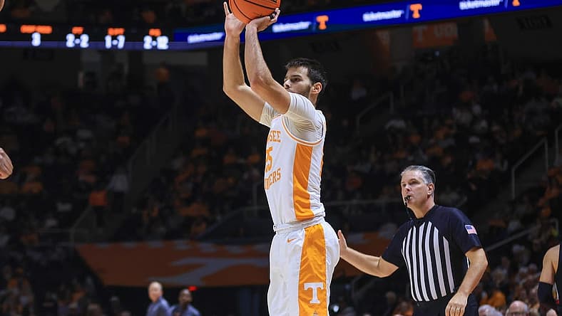 Dec 21, 2022; Knoxville, Tennessee, USA; Tennessee Volunteers guard Santiago Vescovi (25) shoots a three pointer against the Austin Peay Governors at Thompson-Boling Arena. Mandatory Credit: Randy Sartin-USA TODAY Sports