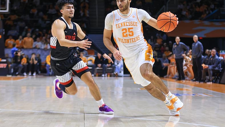 Dec 21, 2022; Knoxville, Tennessee, USA; Tennessee Volunteers guard Santiago Vescovi (25) moves the ball against Austin Peay Governors guard Carlos Paez (1) at Thompson-Boling Arena. Mandatory Credit: Randy Sartin-USA TODAY Sports