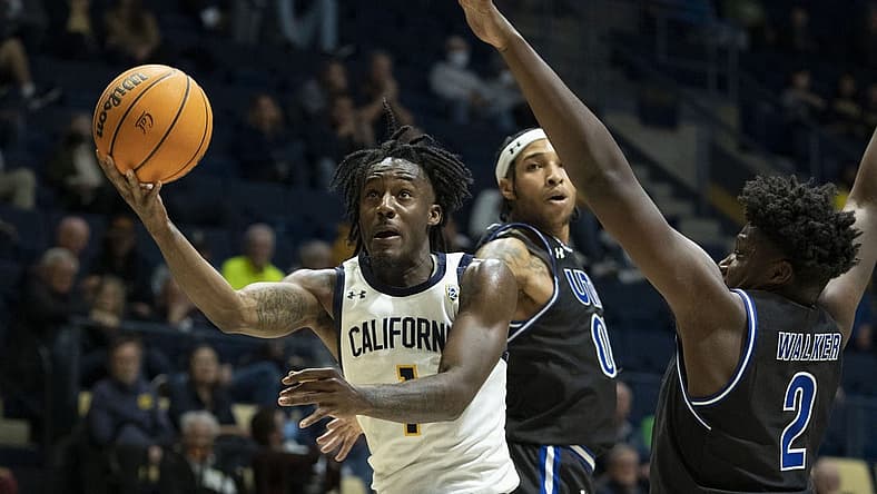 December 21, 2022; Berkeley, California, USA; California Golden Bears guard Joel Brown (1) shoots the basketball against Texas-Arlington Mavericks guard Aaron Cash (00) and forward Brandon Walker (2) during the first half at Haas Pavilion. Mandatory Credit: Kyle Terada-USA TODAY Sports