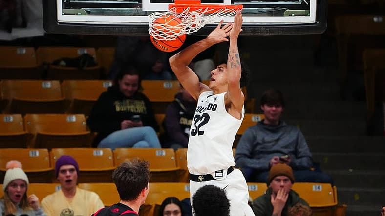 Dec 21, 2022; Boulder, Colorado, USA; Colorado Buffaloes guard Nique Clifford (32) dunks in the first half against the Southern Utah Thunderbirds at the CU Events Center. Mandatory Credit: Ron Chenoy-USA TODAY Sports