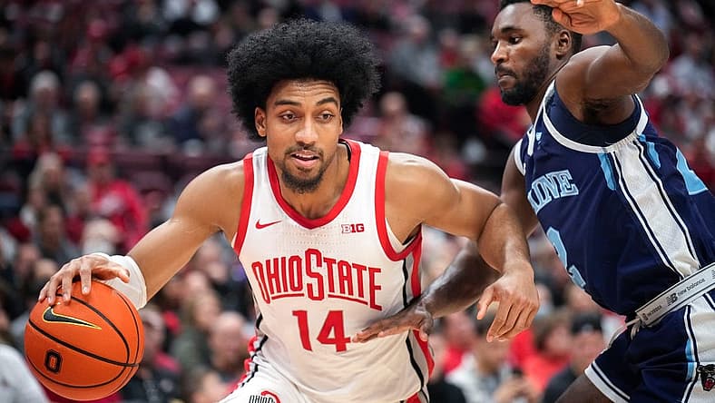 Dec 21, 2022; Columbus, Ohio, United States; Ohio State Buckeyes forward Justice Sueing (14) is defended by Maine Black Bears guard Ja'Shonte Wright-McLeish (2) during the first half of the NCAA division I basketball game at Value City Arena on Wednesday night. Mandatory Credit: Joseph Scheller-The Columbus Dispatch

Basketball Ceb Mbk Maine Maine At Ohio State