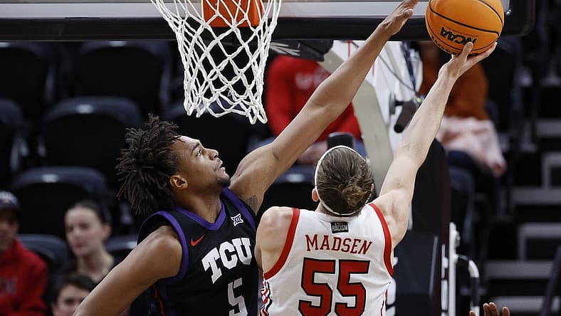 Dec 21, 2022; Salt Lake City, Utah, USA; TCU Horned Frogs forward Chuck O'Bannon Jr. (5) goes for the block on Utah Utes guard Gabe Madsen (55) in the first half at Vivint Arena. Mandatory Credit: Jeffrey Swinger-USA TODAY Sports