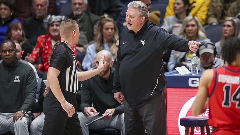 Dec 22, 2022; Morgantown, West Virginia, USA; West Virginia Mountaineers head coach Bob Huggins argues a call with an official during the first half against the Stony Brook Seawolves at WVU Coliseum. Mandatory Credit: Ben Queen-USA TODAY Sports