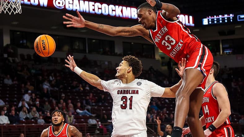 Dec 22, 2022; Columbia, South Carolina, USA; South Carolina Gamecocks forward Benjamin Bosmans-Verdonk (31) and Western Kentucky Hilltoppers center Jamarion Sharp (33) battle for a rebound in the first half at Colonial Life Arena. Mandatory Credit: Jeff Blake-USA TODAY Sports