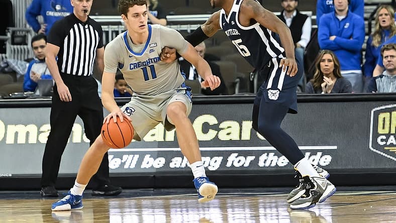 Dec 22, 2022; Omaha, Nebraska, USA; Creighton Bluejays center Ryan Kalkbrenner (11) backs in on Butler Bulldogs center Manny Bates (15) in the first half at CHI Health Center Omaha. Mandatory Credit: Steven Branscombe-USA TODAY Sports