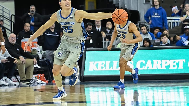 Dec 22, 2022; Omaha, Nebraska, USA; Creighton Bluejays guard Baylor Scheierman (55) reaches for a loose ball against the Butler Bulldogs in the second half at CHI Health Center Omaha. Mandatory Credit: Steven Branscombe-USA TODAY Sports