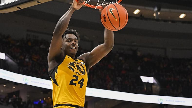 Dec 22, 2022; St. Louis, Missouri, USA; Missouri Tigers guard Kobe Brown (24) dunks against the Illinois Fighting Illini during the first half at Enterprise Center. Mandatory Credit: Jeff Curry-USA TODAY Sports