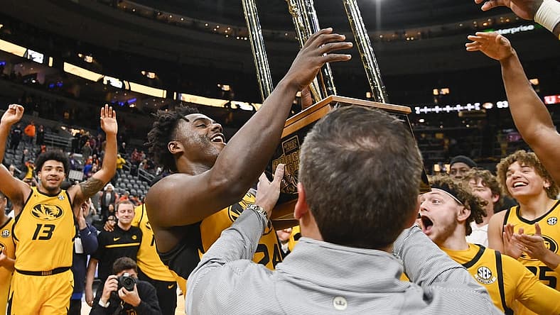 Dec 22, 2022; St. Louis, Missouri, USA; Missouri Tigers guard Kobe Brown (24) reacts as he sees the Braggin Rights Trophy after the Tigers defeated the Illinois Fighting Illini at Enterprise Center. Mandatory Credit: Jeff Curry-USA TODAY Sports