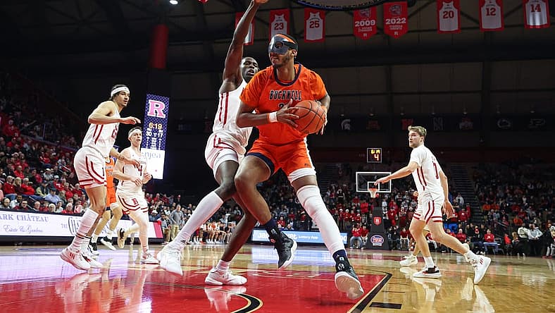 Dec 23, 2022; Piscataway, New Jersey, USA; Bucknell Bison center Andre Screen (23) drives to the basket as Rutgers Scarlet Knights center Clifford Omoruyi (11) defends during the first half at Jersey Mike's Arena. Mandatory Credit: Vincent Carchietta-USA TODAY Sports