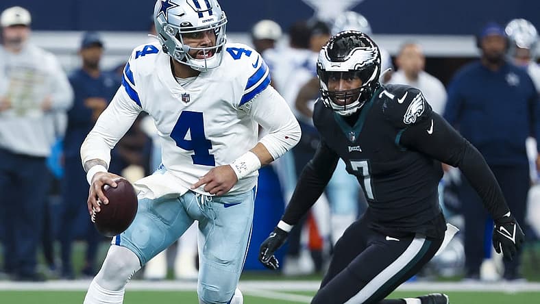 Dec 24, 2022; Arlington, Texas, USA; Dallas Cowboys quarterback Dak Prescott (4) looks to pass as Philadelphia Eagles linebacker Haason Reddick (7) chases during the first quarter at AT&T Stadium. Mandatory Credit: Kevin Jairaj-USA TODAY Sports